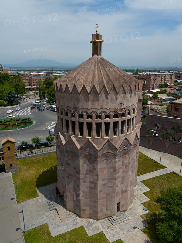 Distinctive stone tower in an urban setting under a blue sky, aerial view, Holy Archangel Church, Echmiadzin, Echmiadzin, Ejmiacin, Vagharshapat, Vagarshapat, Valaršapat, Vagharshapat, Armavir Province, Armenia