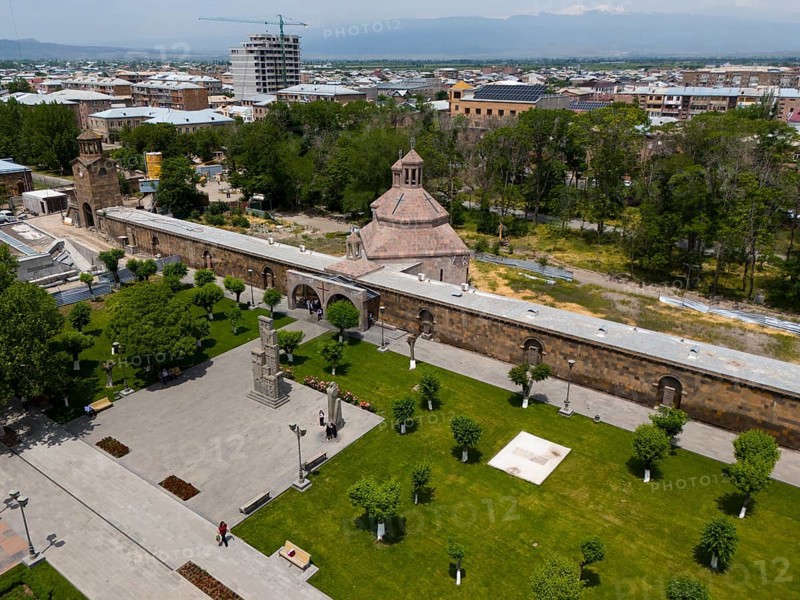 Historical monastery complex in the middle of a green park with city view and mountains in the background, aerial view, St. Vardan and St. Hovhannes Chapel-Baptistery, Echmiadzin, Echmiadzin, Ejmiacin, Vagharshapat, Vagharshapat, Valaršapat, Vagharshapat, Armavir Province, Armenia