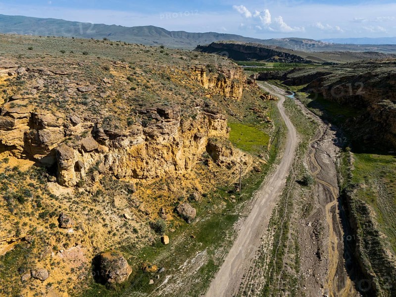 Geological formations along a dirt road in a barren landscape, aerial view, landscape at Angel's Canyon, gorge, Dashtakar, Ararat Province, Armenia