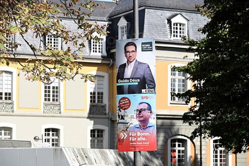 Posters for the North Rhine-Westphalia municipal election campaign in Bonn around the Hofgarten in the university district. CDU politician Guido Deus and SPD politician Jochen Reeh-Schall