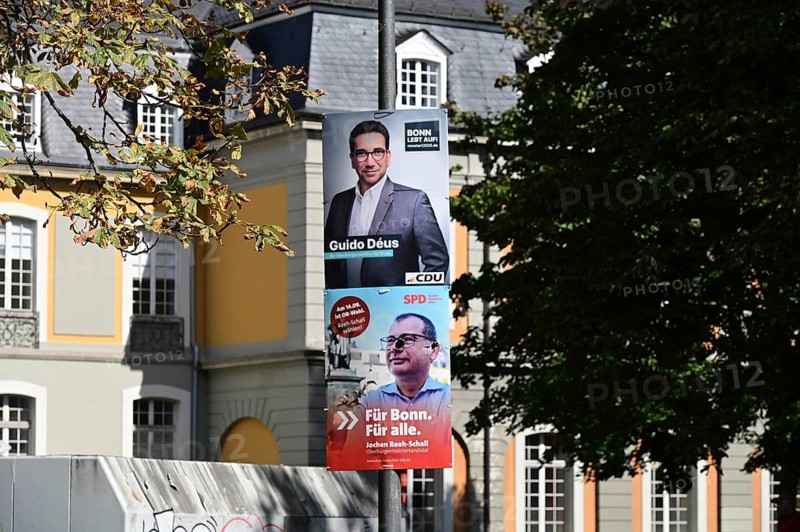 Posters for the North Rhine-Westphalia municipal election campaign in Bonn around the Hofgarten in the university district. CDU politician Guido Deus and SPD politician Jochen Reeh-Schall