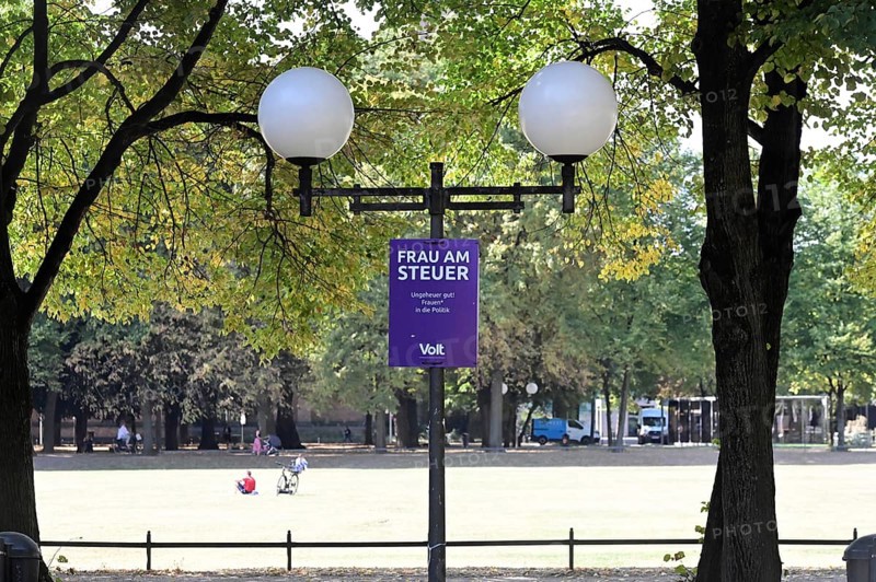 Posters for the North Rhine-Westphalia municipal election campaign in Bonn around the Hofgarten in the university district. Poster by Volt with the inscription Woman at the wheel