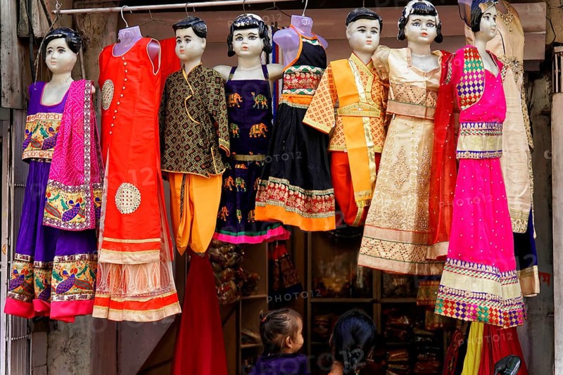Udaipur, Rajasthan, North India, Asia, Colourful traditional dresses on mannequins in a shop