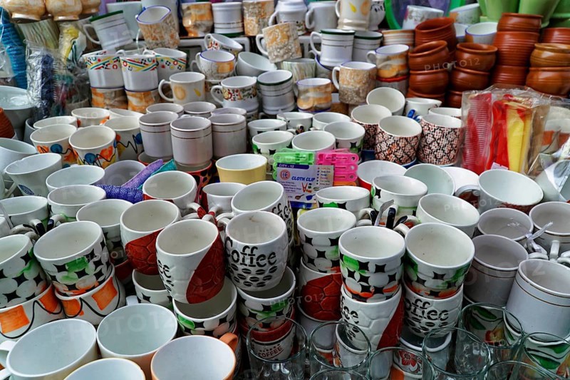 Udaipur, Rajasthan, North India, Asia, Large collection of stacked cups and dishes with colourful designs