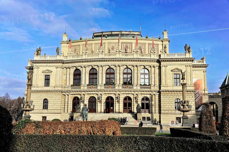 Exterior view of the Rudolfinum with people in front of it, historic building with elaborate classical façade, Prague, Czech Republic
