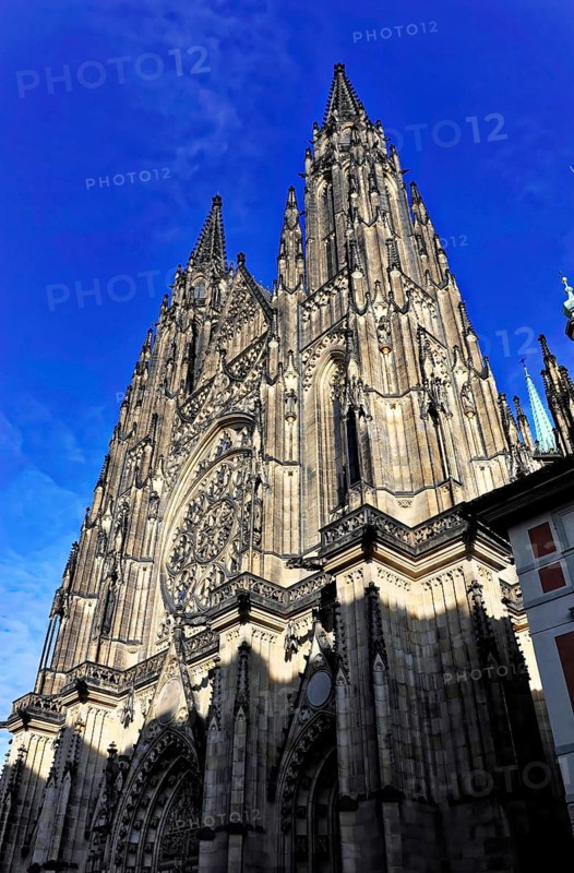 St Vitus or St Vitus Cathedral, Hradcany, Prague, Czech Republic, Europe, Sublime Gothic building with rose window, shining in the morning light against a deep blue sky