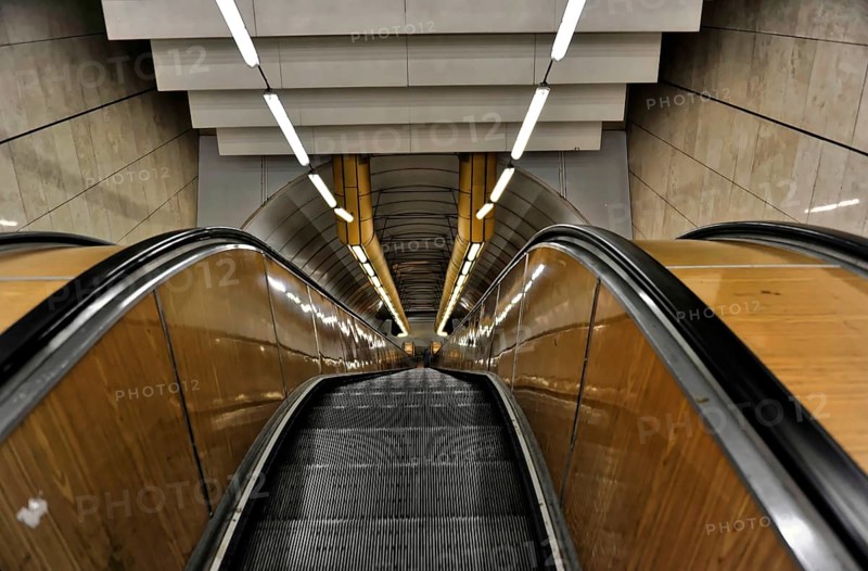 Prague, Czech Republic, Europe, Long escalator in a modern, symmetrical tunnel design