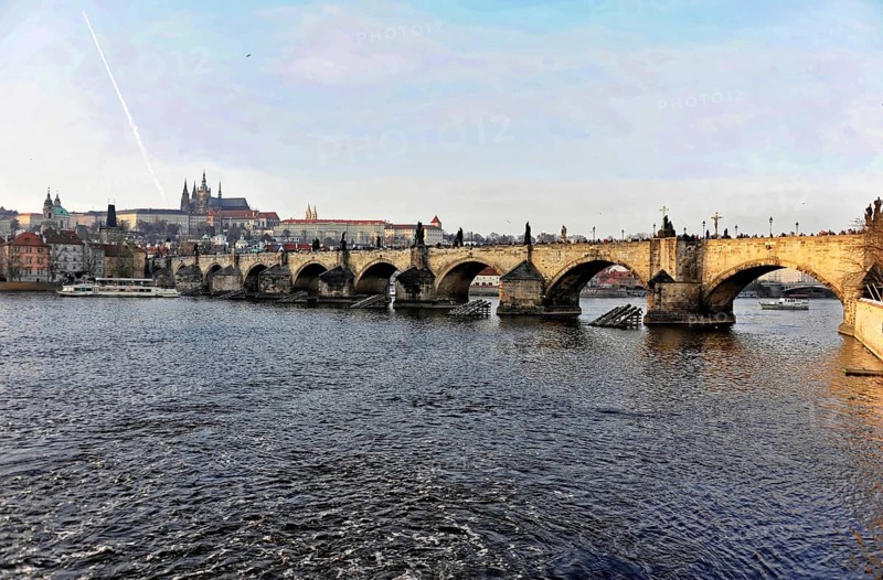 Charles Bridge, Prague, Czech Republic, Europe, Historic bridge over a river in an urban setting with Gothic architecture