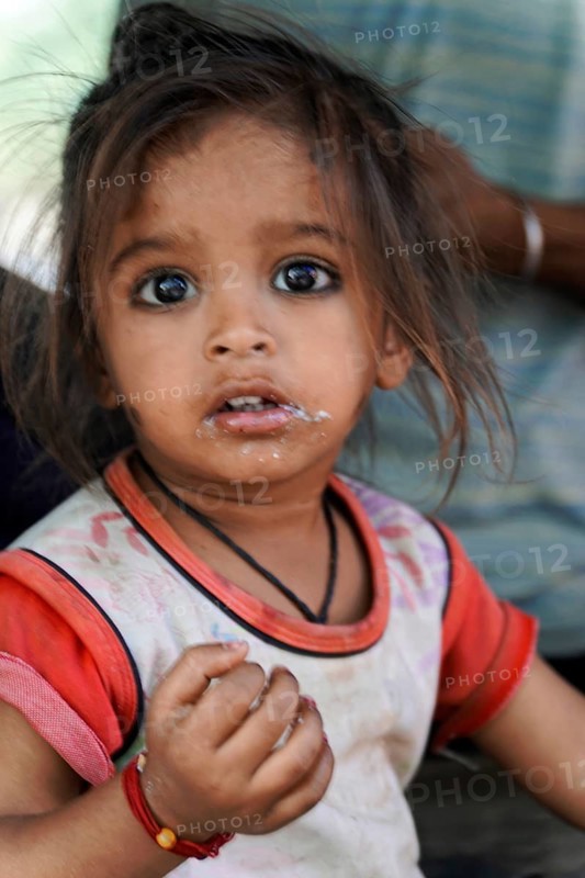 Kota, Rajasthan, North India, Asia, Little girl with natural expression and some dirt on her face, India