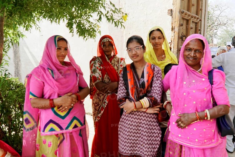 Kota, Rajasthan, North India, Asia, Group of woman in traditional dress standing under a tree, India