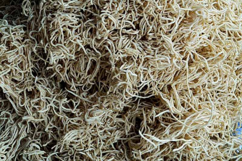 Kota, Rajasthan, North India, Asia, Pile of beige, dried noodles in a chaotic pattern, India