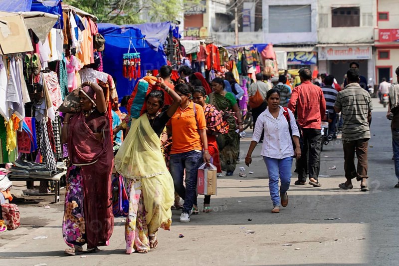 Kota, Rajasthan, North India, Asia, Lively market with people of different ages between colourful stalls, India