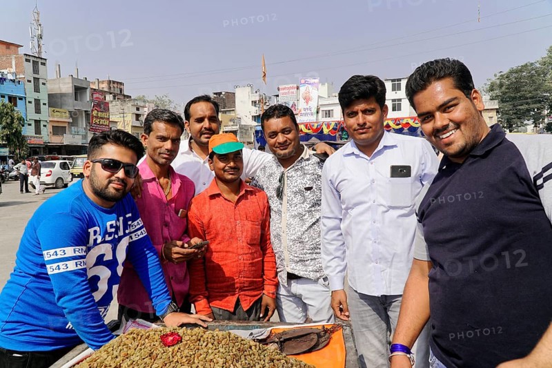 Kota, Rajasthan, North India, Asia, Group of men in sunny weather in an urban environment, radiating conviviality and joy, India