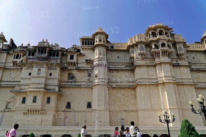 City Palace, Udaipur, Rajasthan, India, Asia, Magnificent Indian palace made of sandstone with decorations and tourists in the foreground, North India