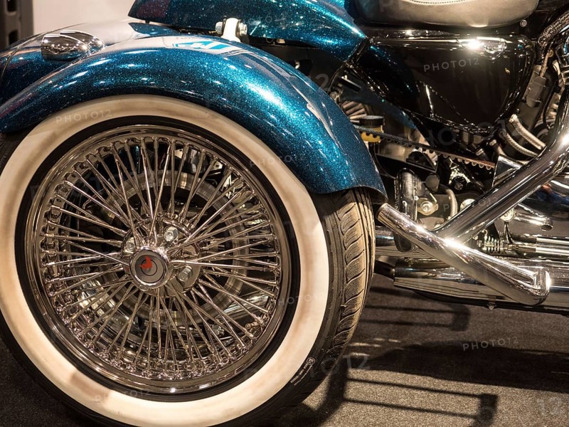 Shiny motorbike wheel with chrome spokes and white-walled tyres, dortmund, deutchland