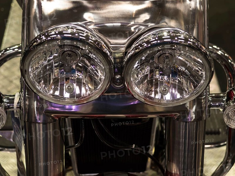 Detailed photo of the chrome headlights of a motorbike, shiny and reflective, dortmund, deutchland