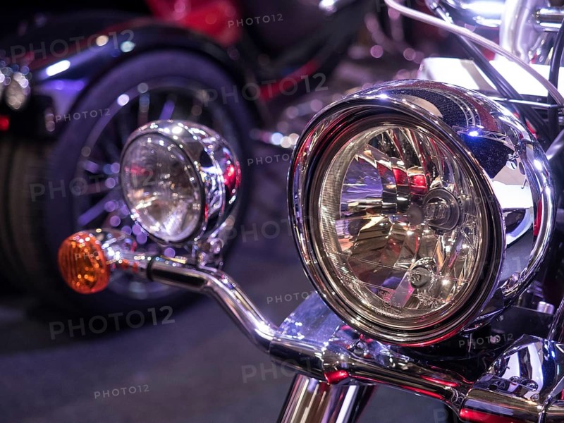 Shiny chrome headlights on a vintage-style motorbike, dortmund, deutchland