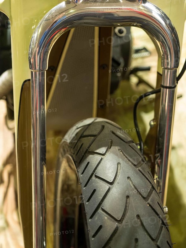 Close-up of a motorbike tyre with shiny chrome suspension, dortmund, deutchland