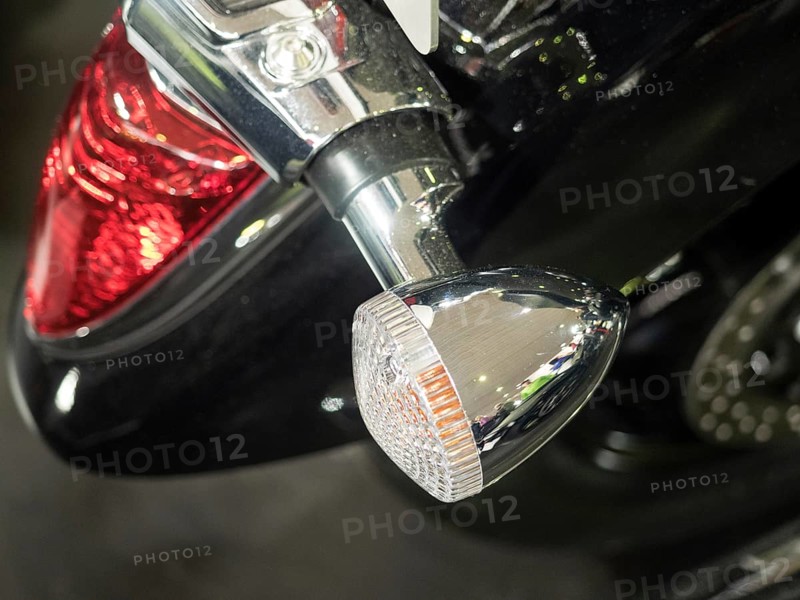 Detailed view of a motorbike tail light and indicator in chrome with black paint, dortmund, deutchland