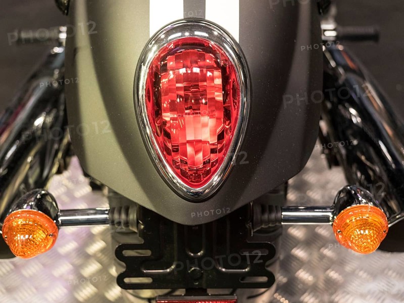 Close-up of a motorbike tail light with red and orange indicators, dortmund, deutchland
