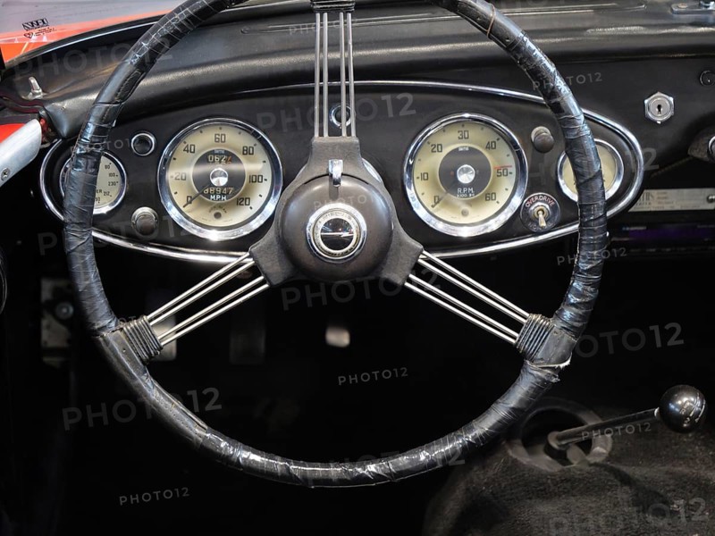 A stylish steering wheel in a classic car, featuring a retro feel and classic instruments, Cologne, Germany