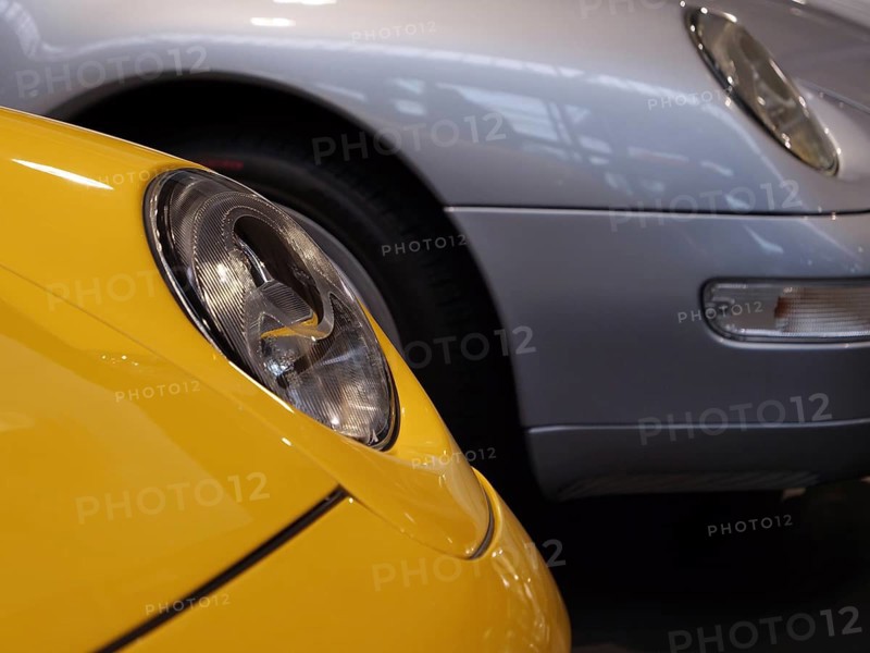 Details of yellow and silver Porsche showing headlights and luxurious design, Cologne, Germany
