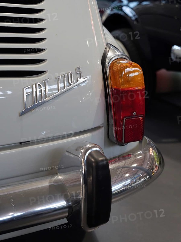 Detail of a white vintage car with tail light and bumper, gives a feeling of vintage elegance, Cologne, Germany