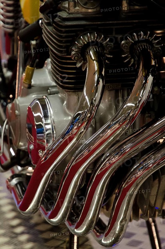 Close-up of shiny metal pipes and engine parts with a focus on mechanical beauty, dortmund, germany
