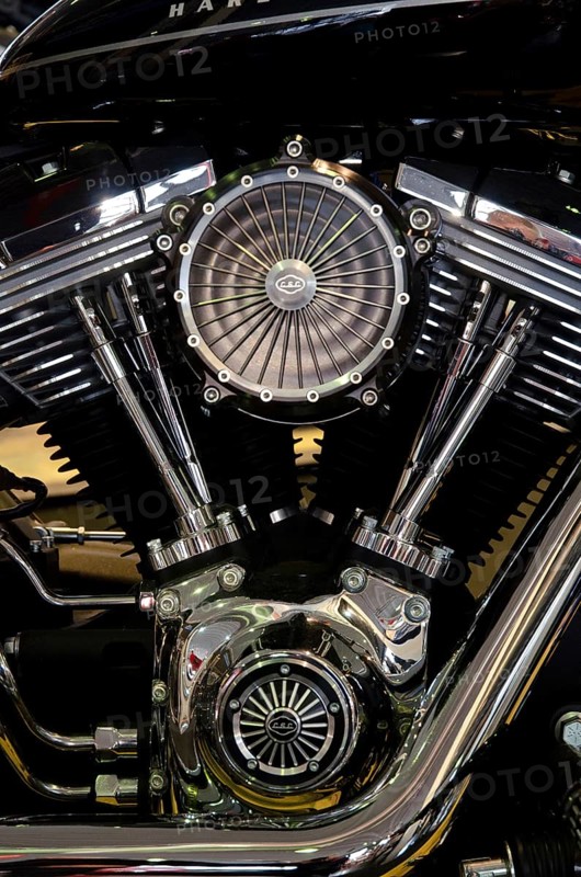 Close-up of a shiny chrome motorbike engine, emphasising the technical precision and robust style, dortmund, germany