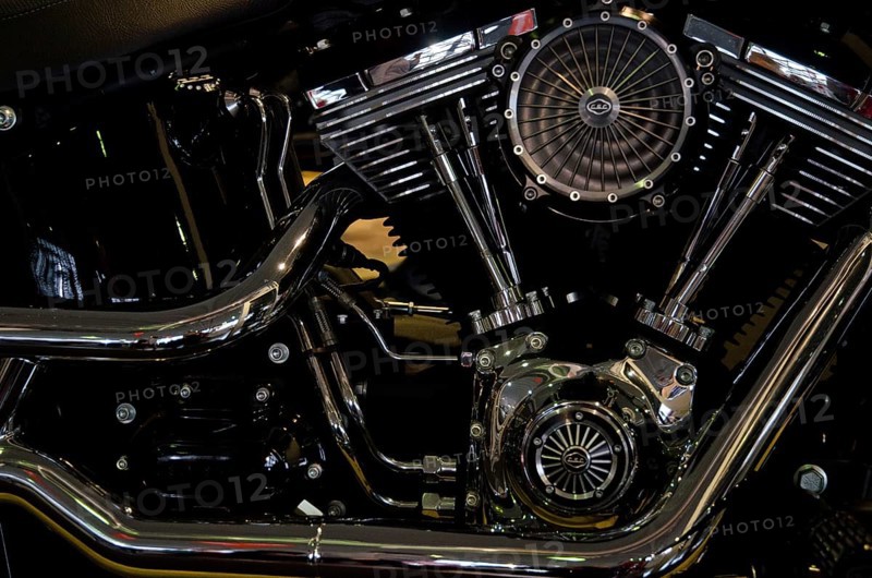 Close-up of a shiny motorbike engine block with visible valves and fan, dortmund, germany