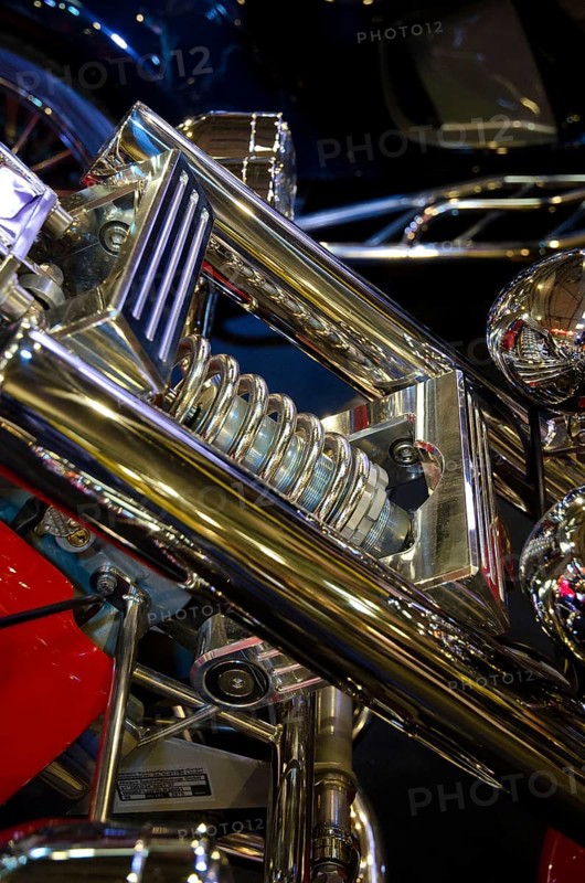 Detailed view of the shiny chrome suspension and frame of a motorbike, dortmund, germany
