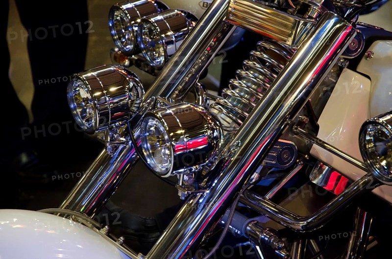 Front part of a motorbike with shiny chrome headlights and white design, dortmund, germany