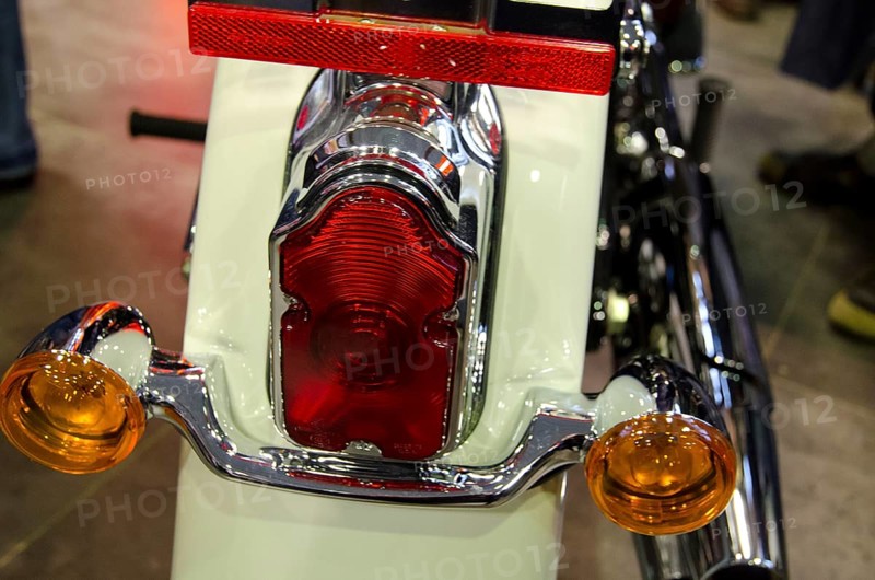 Close-up view of a motorbike tail light with chrome-coloured details and a white housing, dortmund, germany