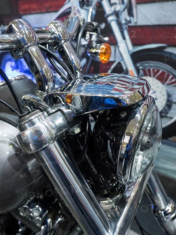 Close-up of the front of a motorbike with shiny chrome details and headlights, dortmund, germany