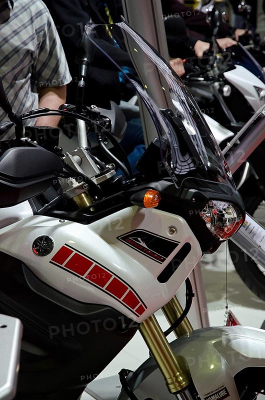 Modern motorbike with sporty design and black windscreen at a trade fair, dortmund, germany