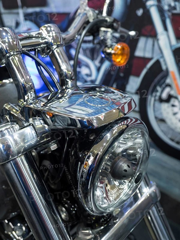 Detailed view of a motorbike headlight with chrome applications, Dortmund, Germany