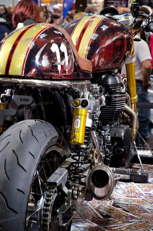 Detail of a customised machine with yellow racing stripes and exhaust, dortmund, germany
