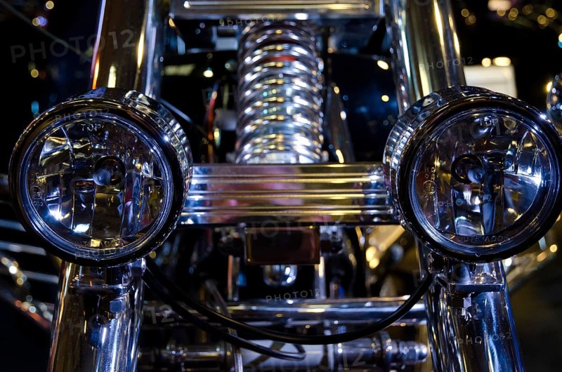 Motorbike with shiny double headlights and chrome at night, dortmund, germany