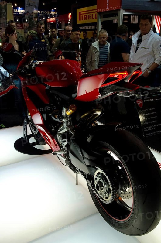 Red sports machine at a trade fair, rear view shows details of the design, dortmund, germany