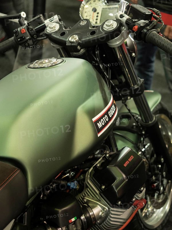Green Moto Guzzi motorbike tank with technical details and accessories, dortmund, germany