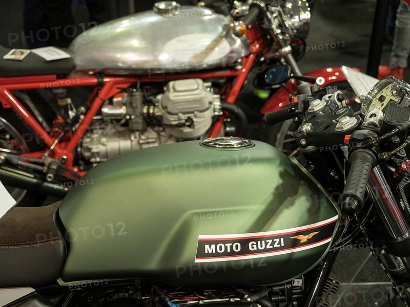 Moto Guzzi tank and motorbikes in retro inspired exhibition, dortmund, germany