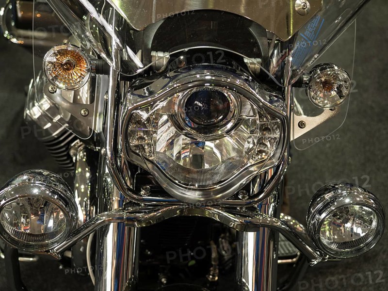 Close-up of a shiny chrome headlight on a motorbike, dortmund, germany