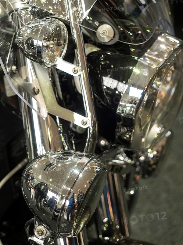 Reflective chrome details of a motorbike with headlight, dortmund, germany