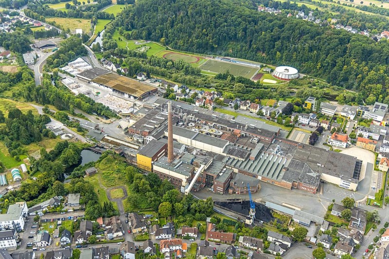Aerial view, R.D.M. Arnsberg GmbH Papierfabrik Reno de Medici, Recycling-Karton location, above Eichholz sports centre with round sports hall football stadium, Arnsberg, Ruhr area, North Rhine-Westphalia, Germany, DE, Europe, football pitch, football stadium, football club, commercial enterprises, commercial area, commercial area, commercial property, commercial site, commercial use, industrial area, industrial site, aerial view, aerial photography, aerial photography, RDM paper mill, sports, sports facilities, sports field, sports venue, stadium, overview, bird's eye view, birds-eyes view, overview
