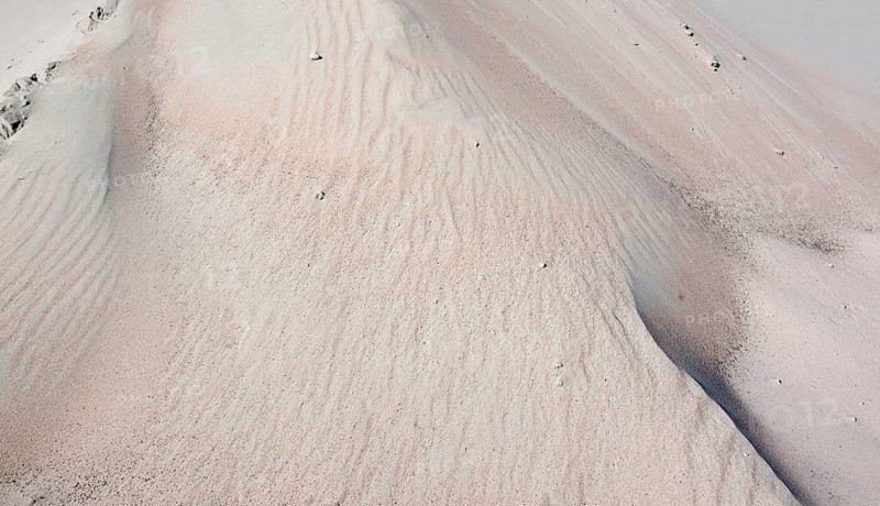Full frame abstract sand background in sunny ambiance