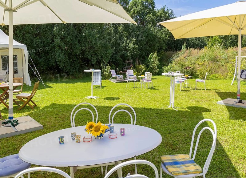 Sunny illuminated idyllic scenery showing a garden prepared for party