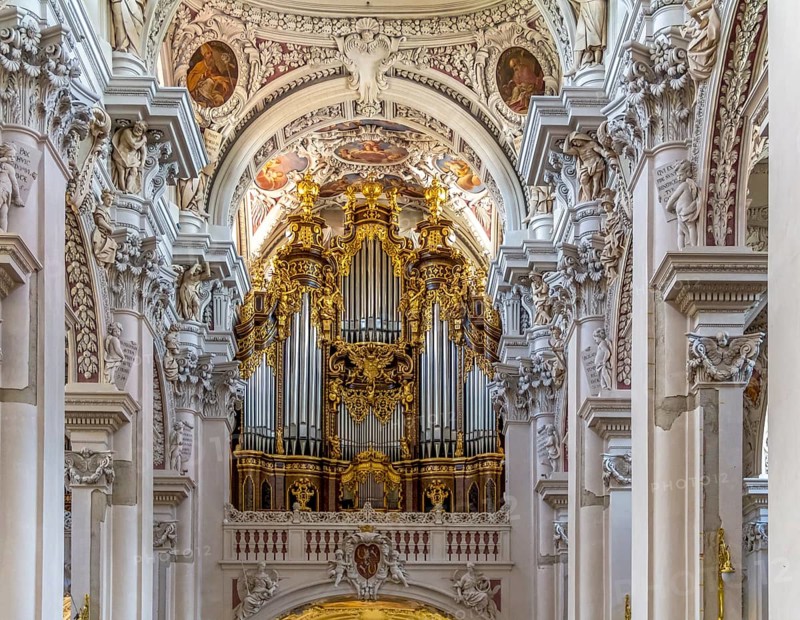 Frontal shot of a rich ornamented church organ