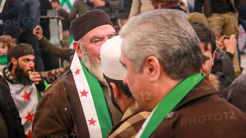 Syrians are seen demonstrating against the rule of Bashar al-Assad while carrying banners and the Syrian revolutionary flag during anti-government protests. Aleppo, Syria. July 30, 2016, Aleppo, Azaz, Syria