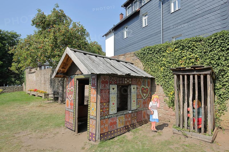 Gingerbread house for the fairy tale Hansel and Gretel, fairy tale figures, hut, wooden posts, locked up, trapped, bars, wooden fence, Brothers Grimm House, Steinau an der Straße, Spessart, Hesse, Germany