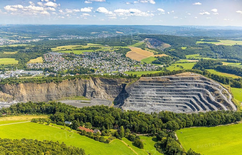 Aerial view, Heinrich Ebel GmbH quarry, Habbel plant, Habbeler Bach, residential area, Müschede district, Müschede, Arnsberg, Ruhr area, North Rhine-Westphalia, Germany, DE, Europe, property tax, real estate, aerial view, aerial photography, aerial photography, quarry, overview, bird's-eye view, residential complex, housing and living, residential area, quality of life, residential neighbourhood, housing estate, residential district, bird's-eye view, overview